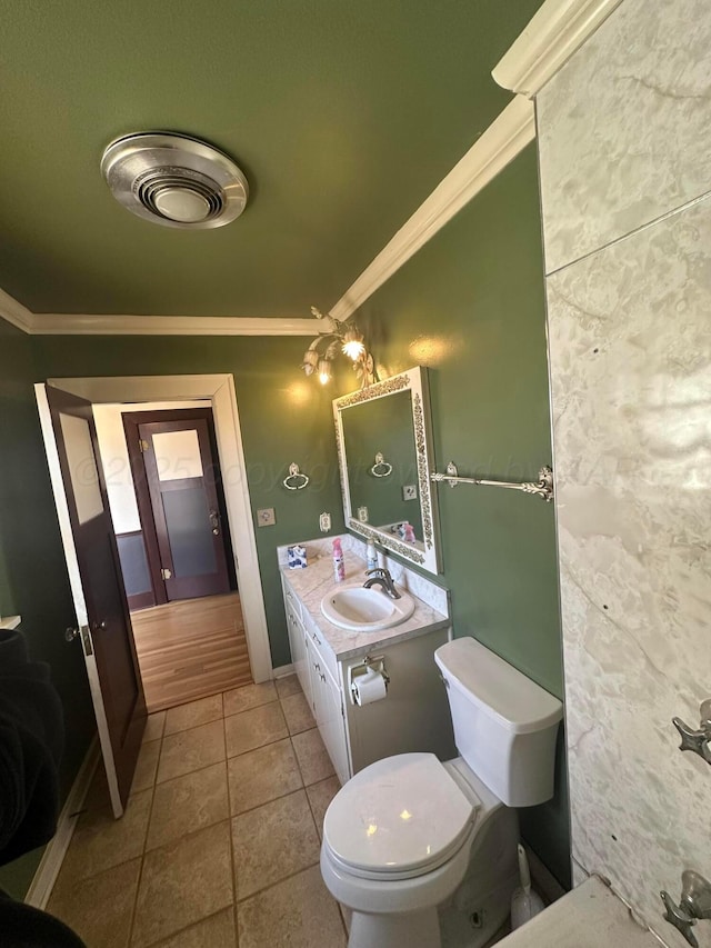 bathroom with vanity, visible vents, crown molding, toilet, and tile patterned floors
