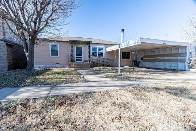 view of front of home featuring a carport