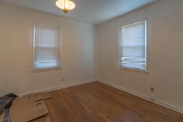 empty room featuring hardwood / wood-style flooring