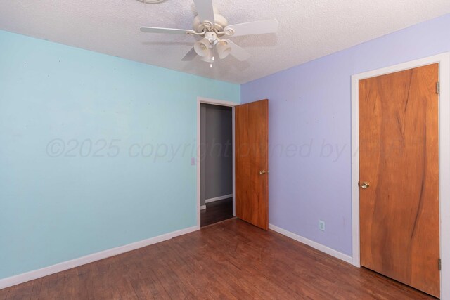 1209 S Main St, Shamrock, TX 79079 - unfurnished bedroom with wood finished floors, a textured ceiling, and ceiling fan