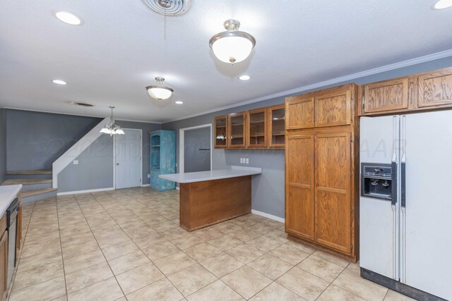 1209 S Main St, Shamrock, TX 79079 - kitchen with white fridge with ice dispenser, brown cabinetry, a peninsula, ornamental molding, and glass insert cabinets