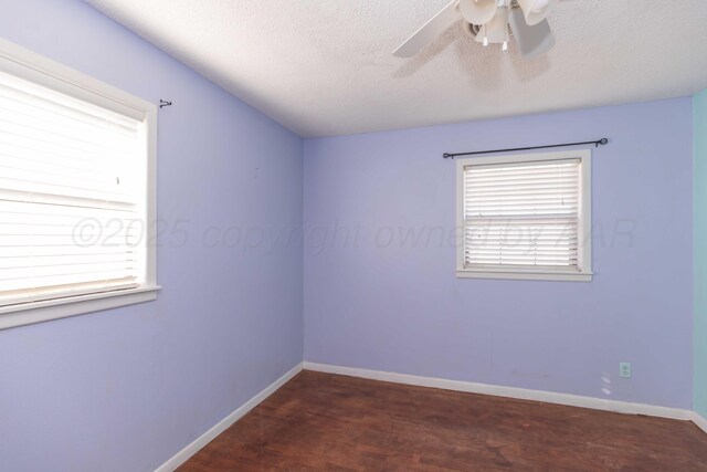 1209 S Main St, Shamrock, TX 79079 - empty room featuring ceiling fan, wood finished floors, and a textured ceiling