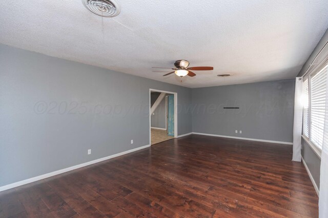 1209 S Main St, Shamrock, TX 79079 - spare room featuring ceiling fan, wood finished floors, and a textured ceiling
