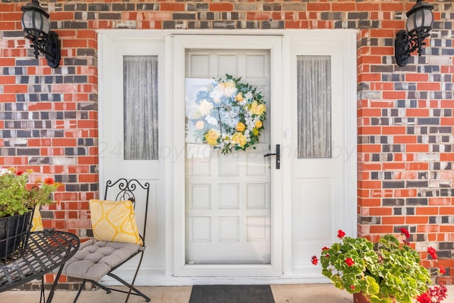 679 Evergreen St, Borger, TX 79007 - doorway to property with brick siding