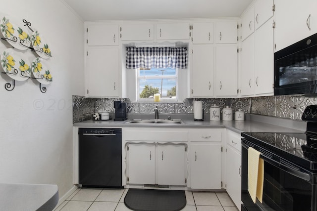 kitchen featuring white cabinets, black appliances, sink, tasteful backsplash, and light tile patterned flooring