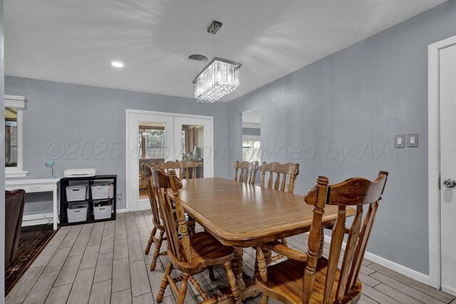 3412 Sunlite St, Amarillo, TX 79109 - dining room with wood finish floors, a chandelier, french doors, and recessed lighting
