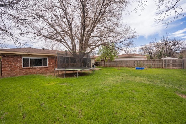 3412 Sunlite St, Amarillo, TX 79109 - fenced backyard featuring a trampoline