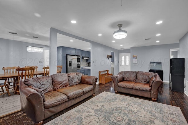 3412 Sunlite St, Amarillo, TX 79109 - living room featuring dark wood-style flooring, a chandelier, and recessed lighting