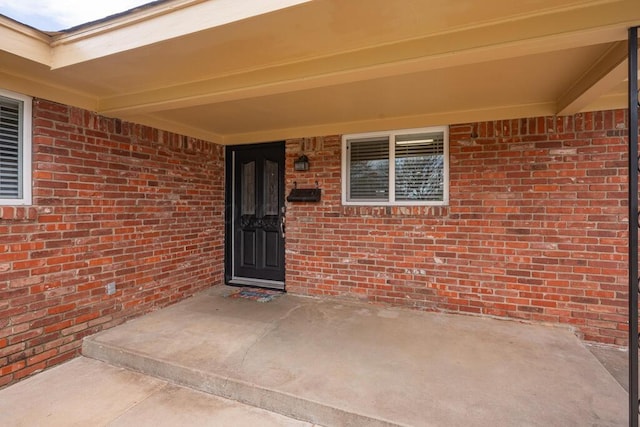 3412 Sunlite St, Amarillo, TX 79109 - property entrance featuring brick siding and a patio area