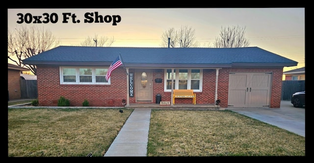 ranch-style home with brick siding and a front yard