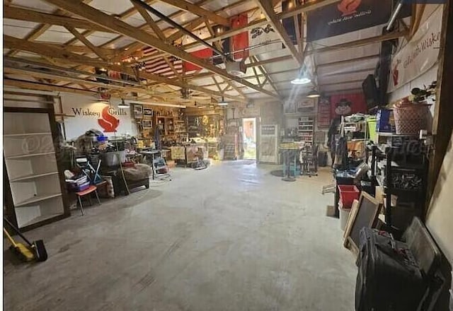 garage featuring a workshop area and a garage door opener