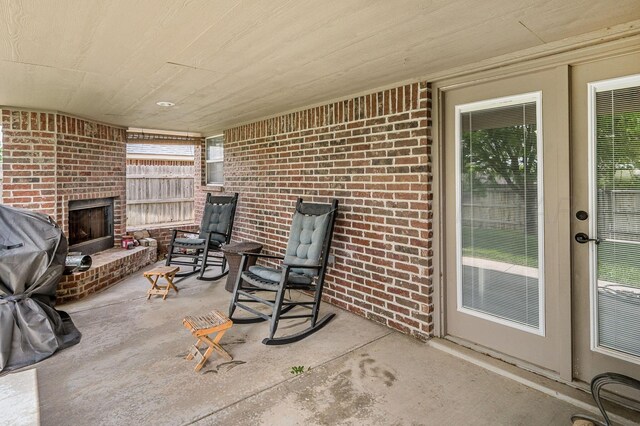 9315 Shylana Ave, Amarillo, TX 79119 - view of patio / terrace with an outdoor brick fireplace