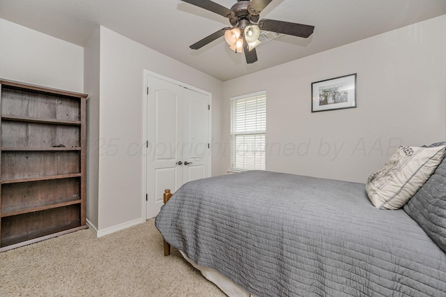 9315 Shylana Ave, Amarillo, TX 79119 - bedroom with light colored carpet, a closet, a ceiling fan, and baseboards