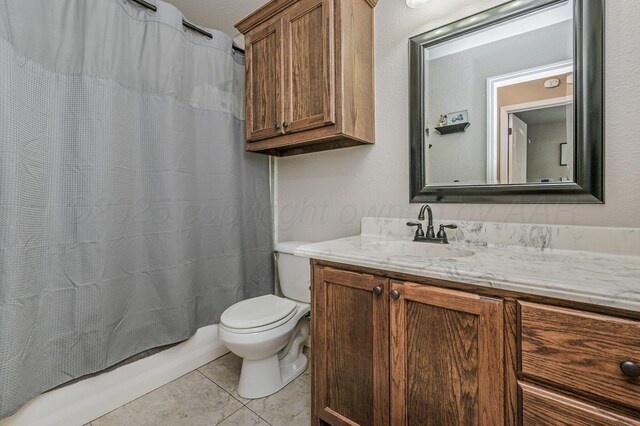 9315 Shylana Ave, Amarillo, TX 79119 - bathroom with vanity, tile patterned flooring, toilet, and shower / bath combination with curtain