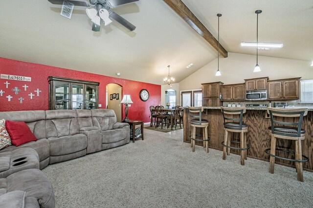 9315 Shylana Ave, Amarillo, TX 79119 - living room with light carpet, a ceiling fan, plenty of natural light, beam ceiling, and a chandelier