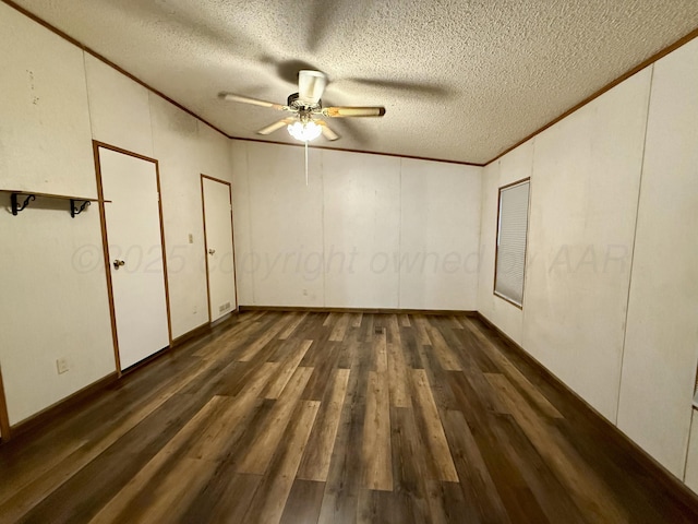 2700 Potter Dr, Amarillo, TX 79108 - unfurnished bedroom with crown molding, a textured ceiling, a decorative wall, and wood finished floors
