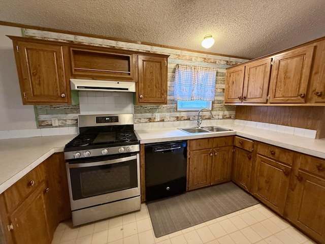2700 Potter Dr, Amarillo, TX 79108 - kitchen with black dishwasher, range hood, a textured ceiling, stainless steel range with gas stovetop, and a sink