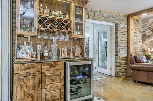 2229 Charles St, Pampa, TX 79065 - indoor dry bar featuring wine cooler and concrete floors