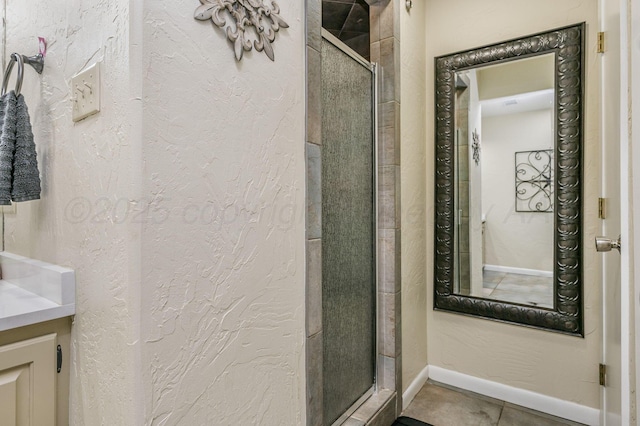 2229 Charles St, Pampa, TX 79065 - full bathroom featuring a stall shower, vanity, and tile patterned floors