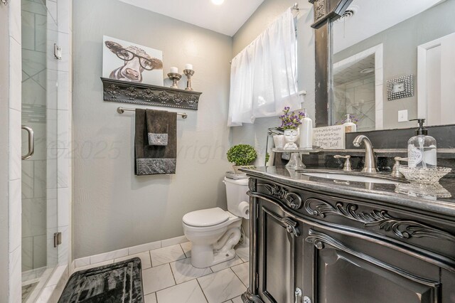 2229 Charles St, Pampa, TX 79065 - bathroom featuring vanity, a shower stall, and marble look tiles