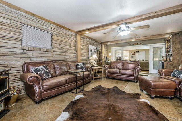 2229 Charles St, Pampa, TX 79065 - living room featuring ceiling fan and wood walls