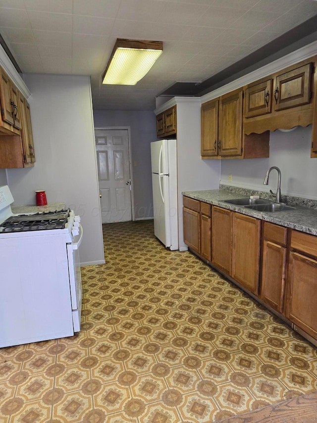 kitchen featuring white appliances and sink