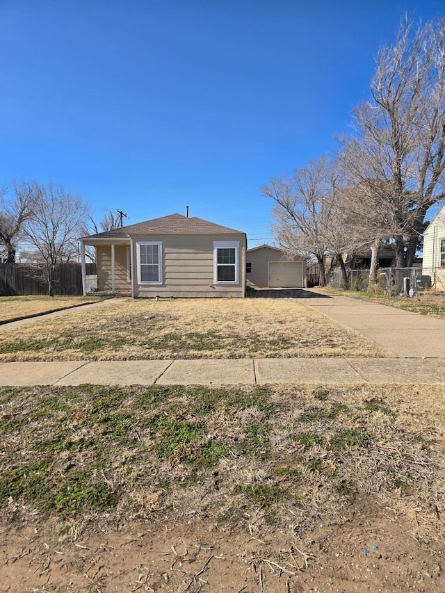 back of property with a garage