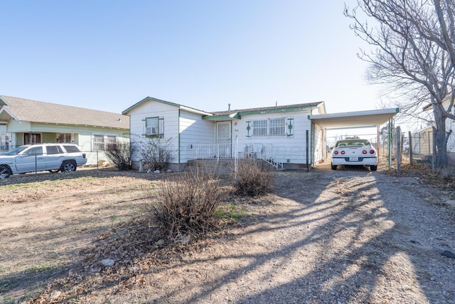1441 NW 14th Ave, Amarillo, TX 79107 - ranch-style home featuring a carport, driveway, and fence
