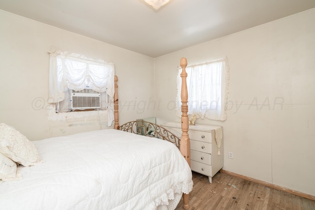 1441 NW 14th Ave, Amarillo, TX 79107 - bedroom featuring cooling unit and wood finished floors