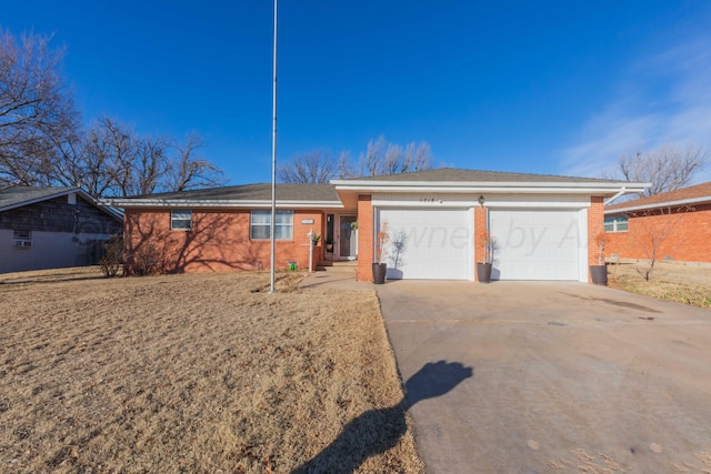 ranch-style home featuring a garage