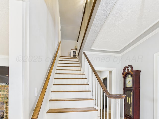 staircase with ornamental molding