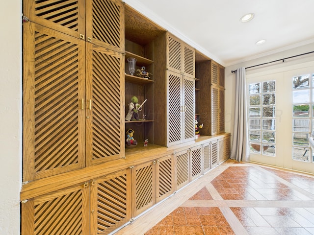 mudroom with ornamental molding, recessed lighting, tile patterned flooring, and french doors