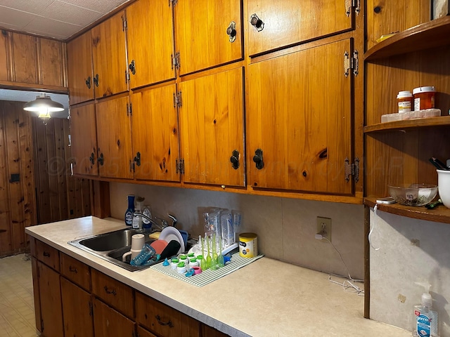 206 Dolomita St, Borger, TX 79007 - kitchen with light countertops, brown cabinets, and open shelves