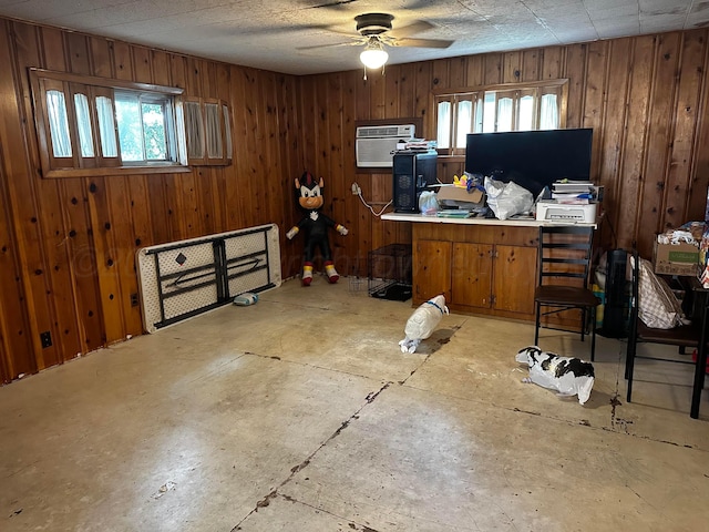 206 Dolomita St, Borger, TX 79007 - office with plenty of natural light, ceiling fan, wooden walls, and a wall mounted AC