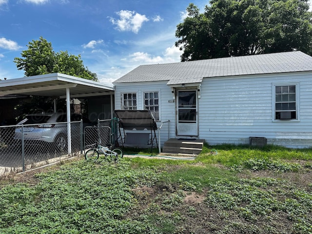 206 Dolomita St, Borger, TX 79007 - view of front of property with entry steps and a carport