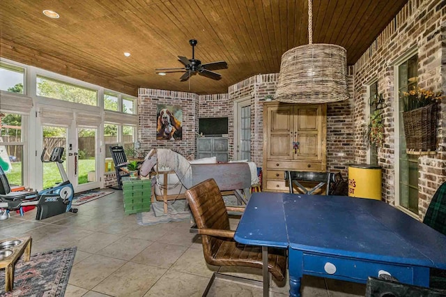 view of patio featuring fence and a ceiling fan