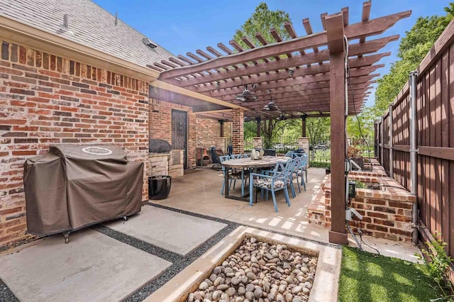view of patio with outdoor dining area, a pergola, a fenced backyard, and grilling area