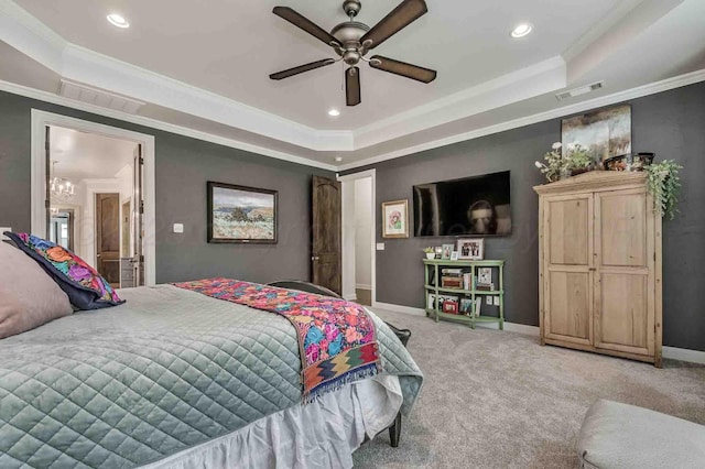 bedroom with a tray ceiling, light carpet, visible vents, and recessed lighting