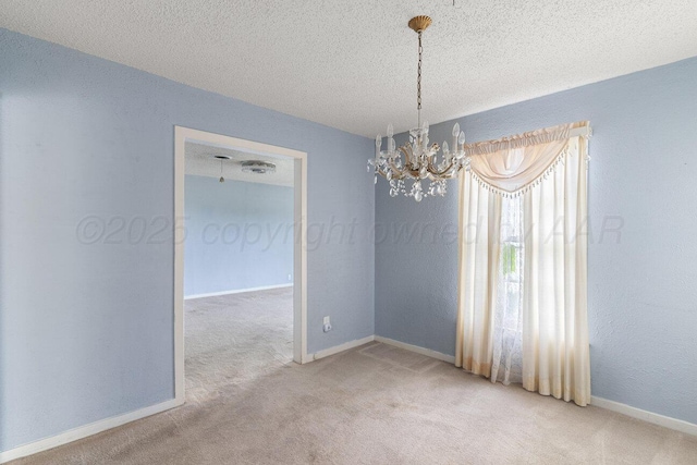1338 Haggard St, Borger, TX 79007 - carpeted empty room with an inviting chandelier, a textured ceiling, and baseboards