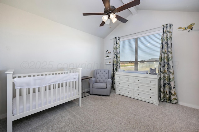 bedroom featuring baseboards, a ceiling fan, a nursery area, light colored carpet, and vaulted ceiling with beams