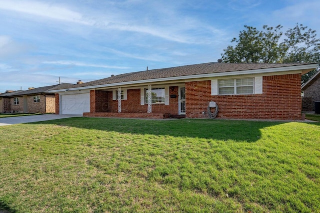 single story home featuring a garage, brick siding, and a front lawn