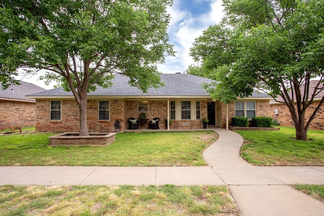 7133 Birkshire Dr, Amarillo, TX 79109 - single story home featuring a front lawn and brick siding
