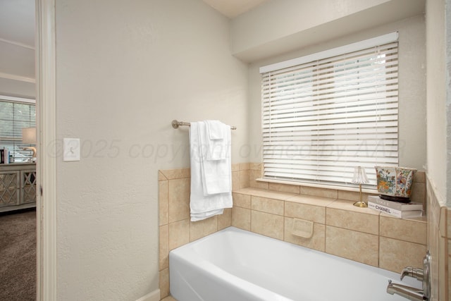 7133 Birkshire Dr, Amarillo, TX 79109 - bathroom featuring a garden tub and plenty of natural light