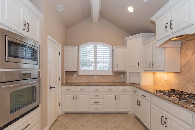 7414 Southbend Dr, Amarillo, TX 79119 - kitchen with appliances with stainless steel finishes, white cabinetry, light tile patterned floors, tasteful backsplash, and light stone counters
