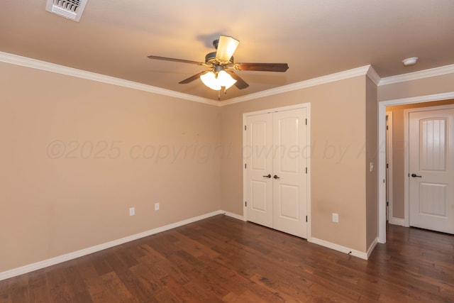 7414 Southbend Dr, Amarillo, TX 79119 - unfurnished bedroom with dark wood-style floors, ornamental molding, a closet, and a ceiling fan