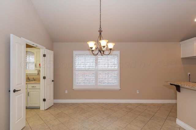 7414 Southbend Dr, Amarillo, TX 79119 - unfurnished dining area with a chandelier, lofted ceiling, and light tile patterned floors