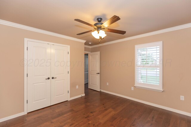 7414 Southbend Dr, Amarillo, TX 79119 - unfurnished bedroom with ornamental molding, dark wood-style flooring, a closet, and a ceiling fan