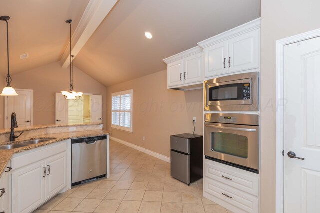 7414 Southbend Dr, Amarillo, TX 79119 - kitchen featuring appliances with stainless steel finishes, white cabinetry, light stone counters, light tile patterned floors, and pendant lighting