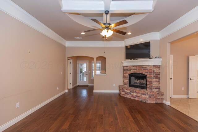 7414 Southbend Dr, Amarillo, TX 79119 - unfurnished living room featuring ceiling fan, ornamental molding, a fireplace, wood finished floors, and recessed lighting