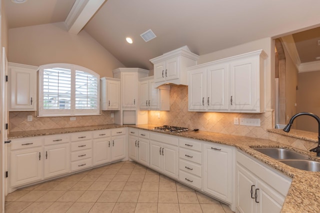 7414 Southbend Dr, Amarillo, TX 79119 - kitchen with stainless steel gas stovetop, white cabinetry, light tile patterned floors, tasteful backsplash, and recessed lighting